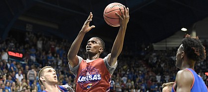 Kansas junior guard Lagerald Vick goes up for a layup during the team's scrimmage in the 33rd-annual Late Night in the Phog on Saturday, Sept. 30, 2017 at Allen Fieldhouse.