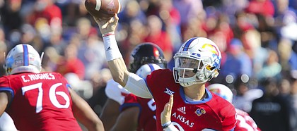 Kansas quarterback Carter Stanley (9) throws a pass during the first quarter on Saturday, Oct. 7, 2017 at Memorial Stadium.