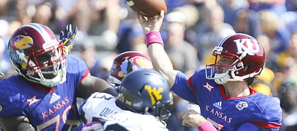 Kansas quarterback Peyton Bender (7) throws during the second quarter on Saturday, Sept. 23, 2017 at Memorial Stadium.