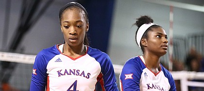 Kansas outside hitter Jada Burse (4) and Kansas right side hitter Kelsie Payne (8) show their frustration as Texas widens its lead in the fourth set on Wednesday, Oct. 11, 2017 at Horejsi Center.