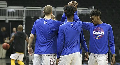 The Kansas guards come together in a huddle prior to tipoff against Missouri for the Showdown for Relief exhibition, Sunday, Oct. 22, 2017 at Sprint Center in Kansas City, Missouri.