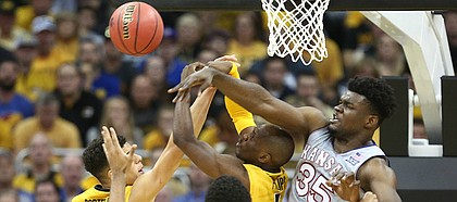Kansas center Udoka Azubuike (35) swats away a ball from several Missouri players during the second half of the Showdown for Relief exhibition, Sunday, Oct. 22, 2017 at Sprint Center in Kansas City, Missouri.