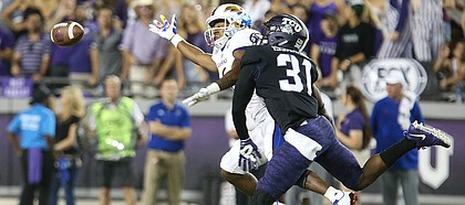 Kansas wide receiver Quan Hampton (6) has a pass broken up by TCU safety Ridwan Issahaku (31) during the second quarter, Saturday, Oct. 21, 2017 at Amon G. Carter Stadium in Fort Worth.
