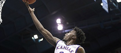 Kansas junior guard Lagerald Vick makes an acrobatic layup Tuesday in an exhibition game against Pittsburg State at Allen Fieldhouse.