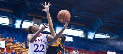 KU's Chayla Cheadle (22) takes the ball to the basket as Pittsburg State's Athena Alvarado (4) defends during the Jayhawks' exhibition victory over the Gorillas on Sunday, Nov. 5, 2017 at Allen Fieldhouse.