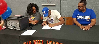 Class of 2018 big man David McCormack signs his national letter of intent to join the Kansas basketball program on Saturday, Nov. 11, 2017, at a ceremony with his family.