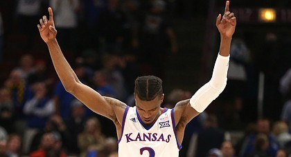 Kansas guard Lagerald Vick (2) raises his arms after the Jayhawks defeated the Wildcats 65-61 during the second half on Tuesday, Nov. 14, 2017 at United Center.