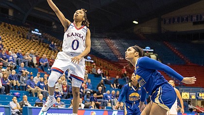 Junior Kansas guard Christalah Lyons scores on a layup Wednesday, Nov. 29, 2017, during a game against UMKC at Allen Fieldhouse. The Jayhawks won, 63-48.