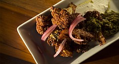 Culinaria's Fried Cauliflower with Labneh, which is a strained yogurt similar to a cream cheese dip.