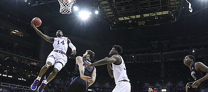 Kansas guard Malik Newman (14) cruises in for a bucket during the first half, Wednesday, Dec. 6, 2017 at Sprint Center.