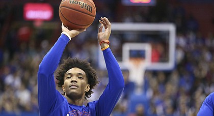 Kansas senior point guard Devonte' Graham throws up a shot in warmups prior to Saturday's game against Arizona State at Allen Fieldhouse.