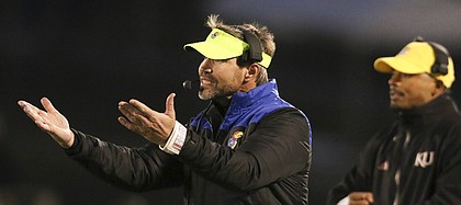 Kansas defensive coordinator Clint Bowen disputes a call during the fourth quarter on Saturday, Nov. 18, 2017 at Memorial Stadium.