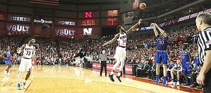 Kansas guard Sviatoslav Mykhailiuk (10) puts up a three from the corner over Nebraska forward Isaac Copeland (14) to give the Jayhawks a one point lead with seconds remaining in the game, Saturday, Dec. 16, 2017 at Pinnacle Bank Arena in Lincoln, Nebraska.