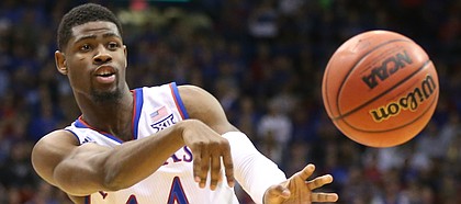 Kansas guard Malik Newman (14) throws a pass during the first half on Monday, Dec. 18, 2017 at Allen Fieldhouse.