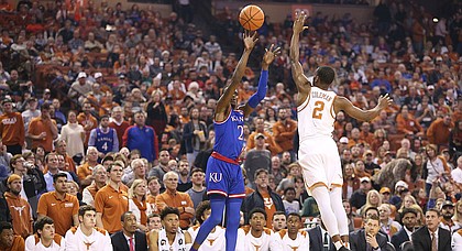 Kansas guard Lagerald Vick (2) puts up a three over Texas guard Matt Coleman (2) during the first half on Friday, Dec. 29, 2017 at Frank Erwin Center in Austin, Texas.