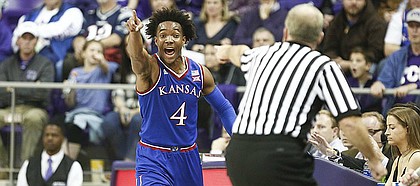 Kansas guard Devonte' Graham (4) signals the ball going the Jayhawks way during the second half, Saturday, Jan. 6, 2018 at Schollmaier Arena.