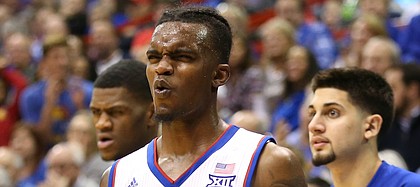 Kansas guard Lagerald Vick (2) reacts to a shot attempt by Kansas guard Devonte' Graham during the second half, Tuesday, Jan. 9, 2018 at Allen Fieldhouse.