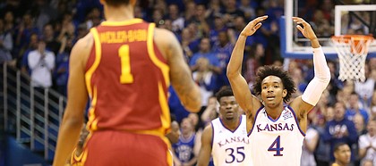 Kansas guard Devonte' Graham (4) raises up the Fieldhouse as Iowa State guard Nick Weiler-Babb (1) brings the ball up the court during the first half, Tuesday, Jan. 9, 2018.