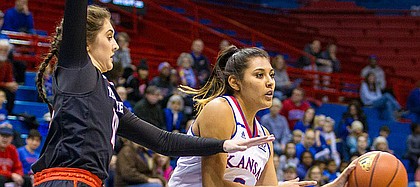 Kansas guard Brianna Osorio (2) looks to pass the ball while being guarded by Texas Tech's Grayson Bright on Wednesday at Allen Fieldhouse.