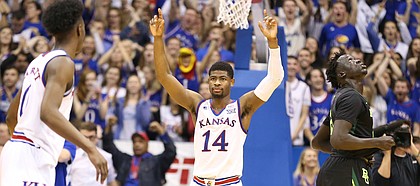 Kansas guard Malik Newman (14) holds up his hands as the buzzer sounds, Saturday, Jan. 20, 2018 at Allen Fieldhouse.