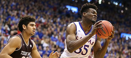 Kansas center Udoka Azubuike (35) pulls a rebound from Texas A&M center Tyler Davis (34) during the first half, Saturday, Jan. 27, 2018 at Allen Fieldhouse.