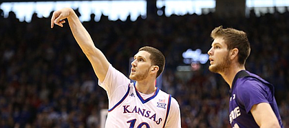 Kansas guard Sviatoslav Mykhailiuk (10) hangs his hand after hitting a three against Kansas State forward Dean Wade (32) during the first half, Saturday, Jan. 13, 2018 at Allen Fieldhouse.