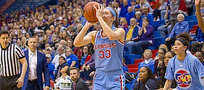 Kansas guard Kylee Kopatich (33) sets up for a 3-pointer late in the fourth quarter Sunday against Kansas State at Allen Fieldhouse.