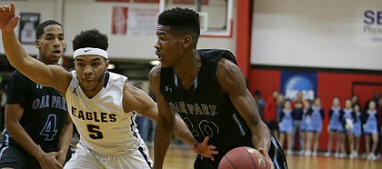 Oak Park High guard Ochai Agbaji drives to the rim during a recent high school game against Liberty North in the William Jewell Tourney last December. The 6-foot-5, 195-pound wing recently became one of the hottest unsigned prospects in the country after picking up offers from Kansas, Nebraska, Oregon, Texas A&M and Wisconsin. On Thursday, Feb. 8, 2018, Agbaji committed to KU during a ceremony at his high school.