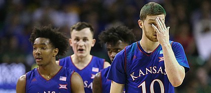 Kansas guard Sviatoslav Mykhailiuk (10) and the Jayhawks come back into the game after a timeout late in the second half, Saturday, Feb. 11, 2018 at Ferrell Center in Waco, Texas.
