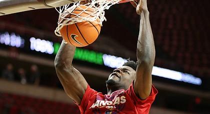 Kansas sophomore center Udoka Azubuike dunks during pre-game warmups at Hilton Coliseum, on Feb. 13, 2018.
