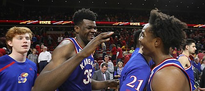 Kansas center Udoka Azubuike (35) smiles as he meets Kansas guard Devonte' Graham (4) in the handshake line following the Jayhawks' 83-77 win over Iowa State, Tuesday, Feb. 13, 2018 at Hilton Coliseum in Ames, Iowa. Graham went two of five from the free throw line in the final minutes.