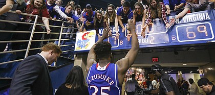 Kansas center Udoka Azubuike (35) reaches to high five the students as he leaves the court following the Jayhawks' 77-69 win over the Mountaineers, Saturday, Feb. 17, 2018 at Allen Fieldhouse.