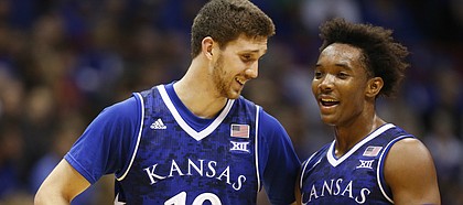 Kansas guards Sviatoslav Mykhailiuk (10) and Devonte' Graham (4) make conversation during the second half, Friday, Nov. 18, 2016 at Allen Fieldhouse.