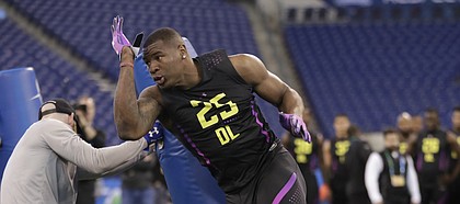 Kansas defensive lineman Dorance Armstrong runs a drill at the NFL football scouting combine in Indianapolis, Sunday, March 4, 2018. (AP Photo/Michael Conroy)