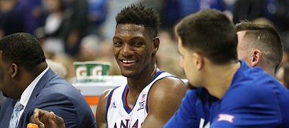 Kansas forward Silvio De Sousa (22) laughs on the bench with his teammates during the second half, Thursday, March 8, 2018 at Sprint Center in Kansas City, Mo.
