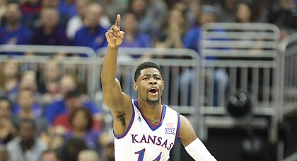 Kansas guard Malik Newman (14) signals the ball going the Jayhawks' way after a turnover by Kansas State during the first half, Friday, March 9, 2018 at Sprint Center in Kansas City, Mo.