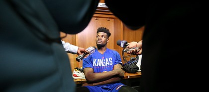 Kansas center Udoka Azubuike (35) takes questions from media members in the team locker room on Friday, March 16, 2018 at Intrust Bank Arena in Wichita, Kan.
