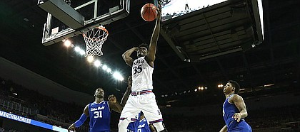 Kansas center Udoka Azubuike (35) reaches for a ball in the post during the second half, Saturday, March 17, 2018 in Wichita, Kan.