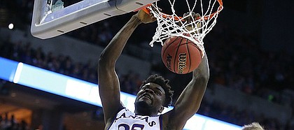 Kansas center Udoka Azubuike (35) delivers a jam before Clemson forward Mark Donnal (5) during the first half, Friday, March 23, 2018 at CenturyLink Center in Omaha, Neb.