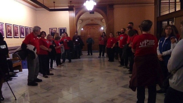 Teachers gather outside the Senate chamber at the Kansas Statehouse to urge lawmakers to pass a school finance bill Saturday, April 7, 2018.