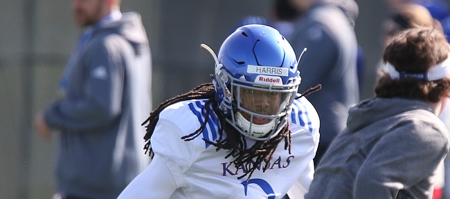 Kansas cornerback Corione Harris chases down a target during practice on Wednesday, April 4, 2018.