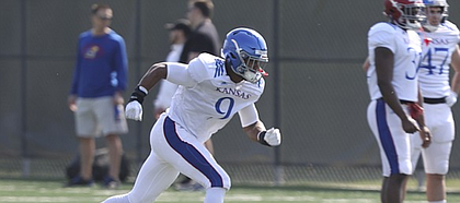 Kansas defensive lineman Najee Stevens-McKenzie takes off during a drill on Tuesday, April 10, 2018.
