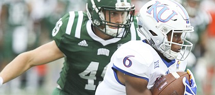 Kansas wide receiver Quan Hampton (6) takes off on a run past Ohio linebacker Jared Dorsa (49) during the fourth quarter on Saturday, Sept. 16, 2017 at Peden Stadium in Athens, Ohio.