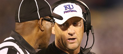 Kansas head coach David Beaty talks with an official after a targeting call was made during the fourth quarter on Saturday, Sept. 2, 2017 at Memorial Stadium. The call was eventually reversed.
