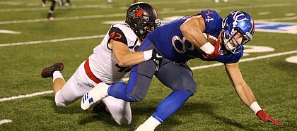 Kansas tight end Ben Johnson (84) is dragged down by Southeast Missouri linebacker Rider Garrett (42) after making a deep catch during the third quarter on Saturday, Sept. 2, 2017 at Memorial Stadium.