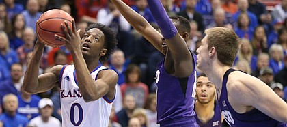 Kansas guard Marcus Garrett (0) moves in for a bucket during the first half on Tuesday, Feb. 6, 2018 at Allen Fieldhouse.
