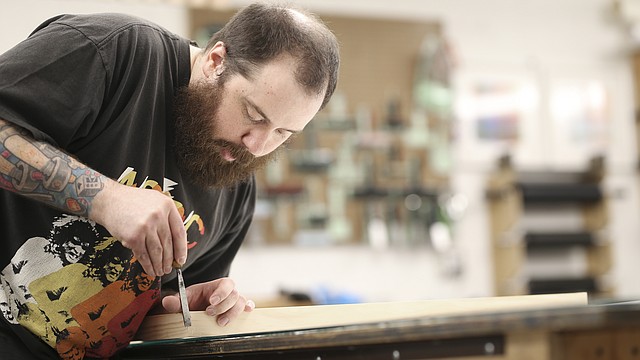 Lawrence Arts Center artist-in-residence Michael Benedetti works on creating a frame in preparation for his show, "The Architecture of Memory," which opens on May 18 at the Arts Center, 940 New Hampshire St.