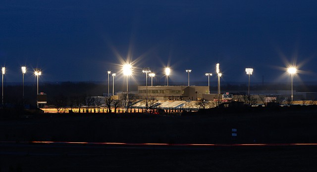 From a view looking north, the lights of the Rock Chalk Sports Park illuminate the facilities on Monday, April 7, 2014.