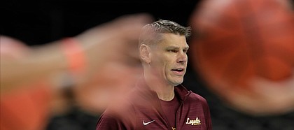 Loyola-Chicago head coach Porter Moser watches his players during a practice session for the Final Four NCAA college basketball tournament, Friday, March 30, 2018, in San Antonio.