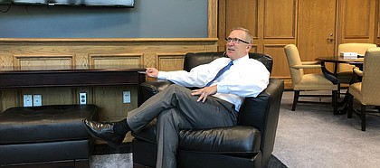 New Kansas athletic director Jeff Long, pictured here during his first day on the job on Aug. 1, 2018, hosted a small gathering with media members in his office to discuss, among other things, football, fund-raising and his adjustment to life in Lawrence.